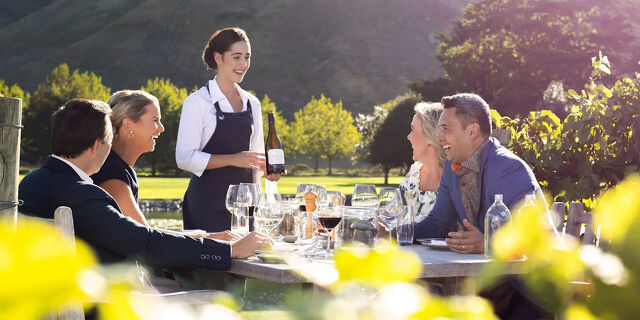 Investor Pathways Lady Serving Wine in a Vineyard